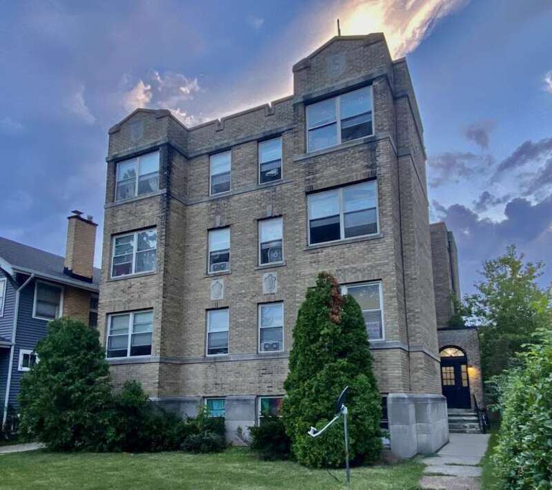 The Stirling Arms Apartments (sic), 132 Sterling Avenue, Buffalo, New York, August 2022. A four-story brick apartment building of a type that's common enough elsewhere in the city but quite rare to see on a side street in the suburb-like North Park