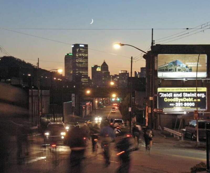Pittsburgh Critical Mass descending Penn Ave, at &quot;the dough boy&quot; in Lawrenceville