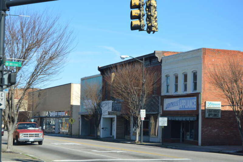 Buildings on the eastern side of Sycamore Street, seen looking north from Wythe Street, in Petersburg, Virginia, United States.  From right to left, they are:
33 S. Sycamore, built 1920
27-31 S. Sycamore, built 1915
23 S. Sycamore, built 1930
9 S.