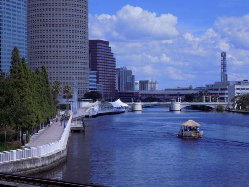 The Tampa Riverwalk along the Hillsborough River in July 2021 taken from the Cass Street Bridge