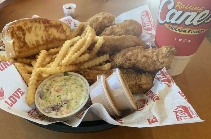 Raising Cane’s Caniac Combo: 6 chicken fingers, coleslaw, fries, Texas toast, Cane’s sauce, and a large lemonade