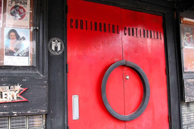 The front door of the The Continental Club on South Congress, Austin, Texas, United States showing the City of Austin Landmark plaque.
