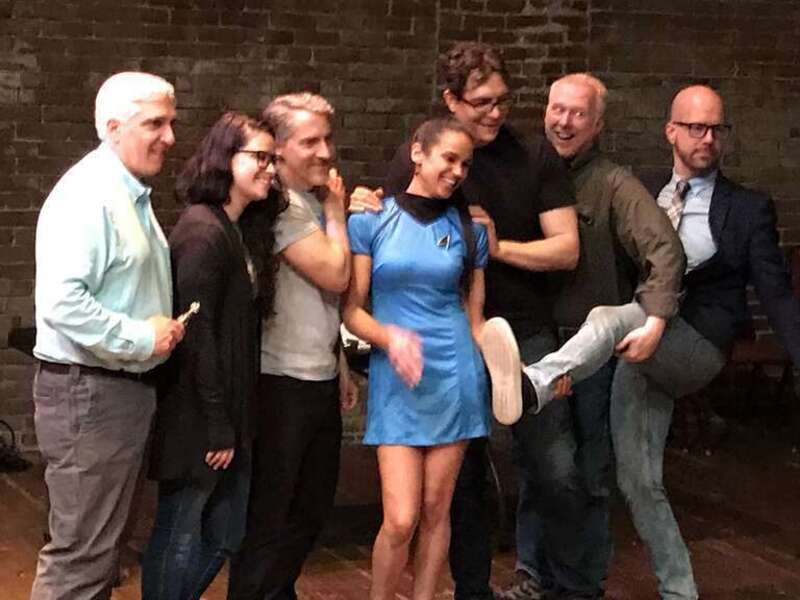 The Skeptic's Guide to the Universe cast during The Know Show posing with a role-playing guest