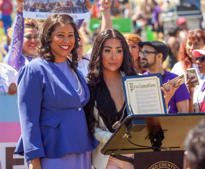 San Francisco mayor London Breed poses alongside Melanie Ampon at a press conference at the 2019 San Francisco Trans March. Mayor Breed had just announced a proclamation declaring June 28, 2019 to be &quot;Trans March Day&quot;.