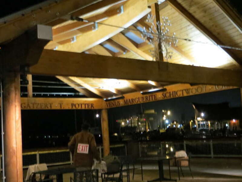 Man in rest area along West Bay promenade.