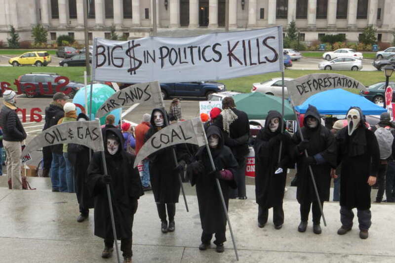 Protest at the Legislative Building in Olympia, Washington (2013.01.14). Reapers. &quot;Big $ in politics kills&quot;, &quot;Tar Sands&quot;, &quot;Oil &amp;amp; Gas&quot;, &quot;Coal&quot;, &quot;Deforestation&quot;.