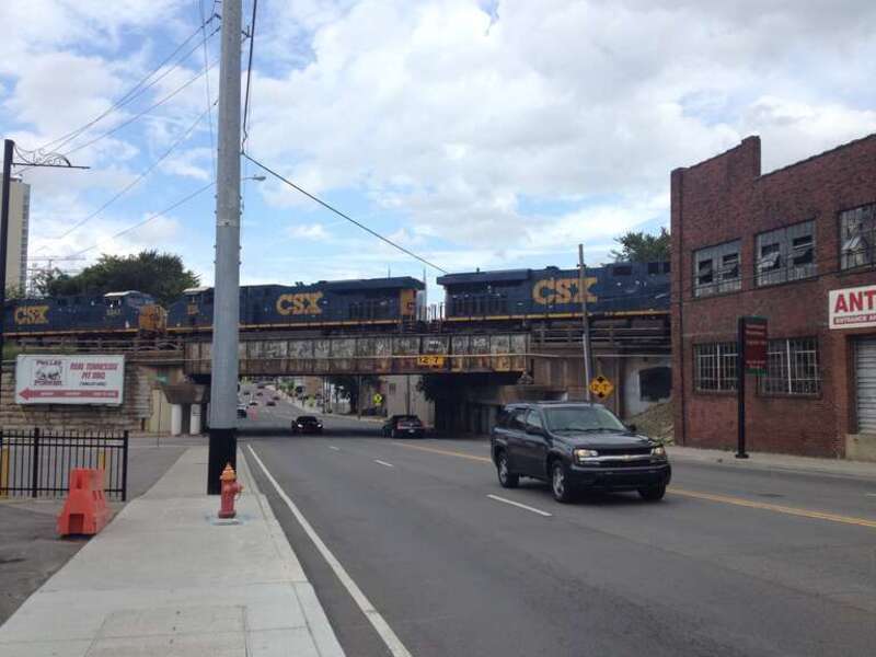 Northbound U.S. Route 31 (8th Avenue) approaching the intersection with Gleaves Street and a bridge under a CSX railroad line in Nashville, Tennessee