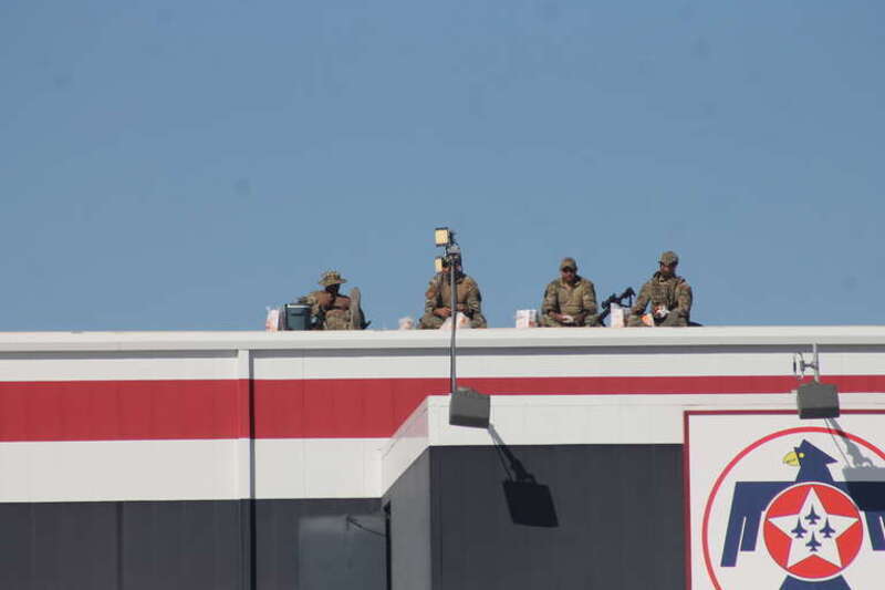 Four Airmen of the United States Air Force eating popeyes while watching over the crowd at Aviation Nation 2019. Aviation Nation is an airshow at Nellis Air Force Base.