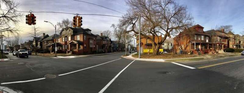 Looking from southeast (left) to northwest (right) from Van Dyke Street just before the corner of East Lafayette Street, this December 2020 panoramic view places us squarely in the West Village Historic District of lower east side Detroit. While
