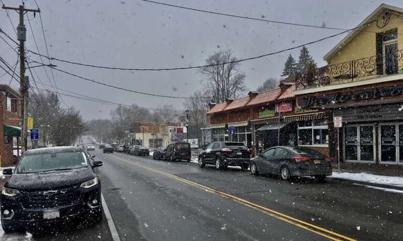 A view southward down Westcott Street in Syracuse, New York, from near the corner of Harvard Place, as seen on a snowy March 2021 afternoon. A youthful and trendy neighborhood thanks to its proximity to the campus of Syracuse University, the
