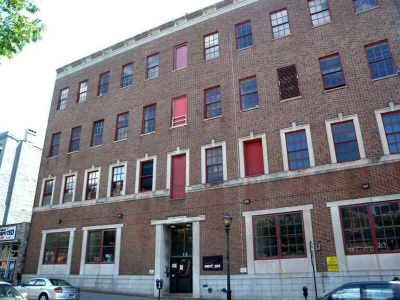 Looking southeast across Main Street at Verizon on a sunny early afternoon.