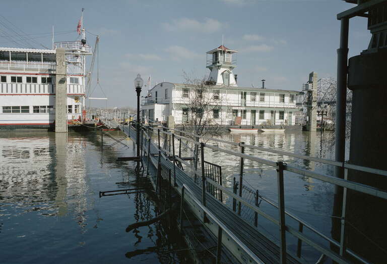 Looking N from River Road between 3rd and 4th Sts.:
Temporary scaffolding used to cross high water to "Belle of Louisville" (left) and wharf boat "Mayor Andrew Broaddus" (recently remodeled).
Ohio River mile 604
Upper gauge = 26 feet (12 feet is
