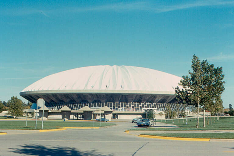 Assembly Hall is an arena, which is  part of the University of Illinois, and is used for basketball and other sports events, and for performances.  It has 16,000 permanent seats, and can hold up to 17,200 spectators as a theater in the round.  It was