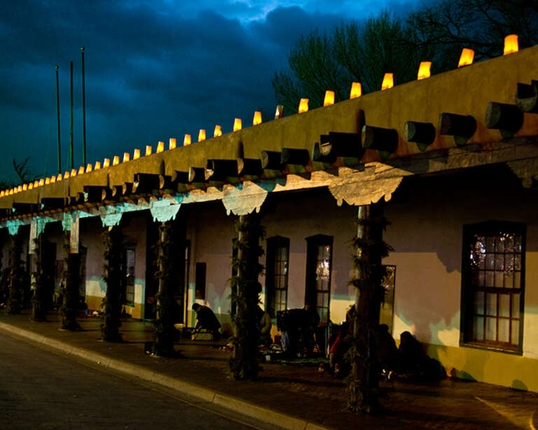 Indian artisans packing up after a day of selling jewelry at the Palace of the Governors in Santa Fe