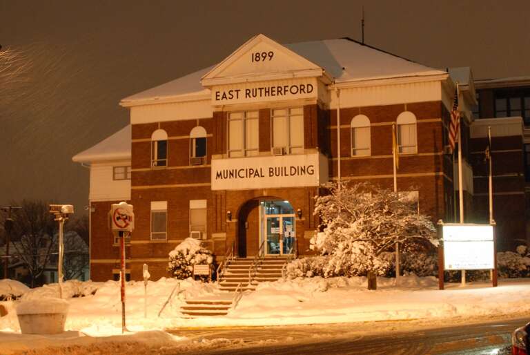 The Municipal Building of East Rutherford at a Snow night.
