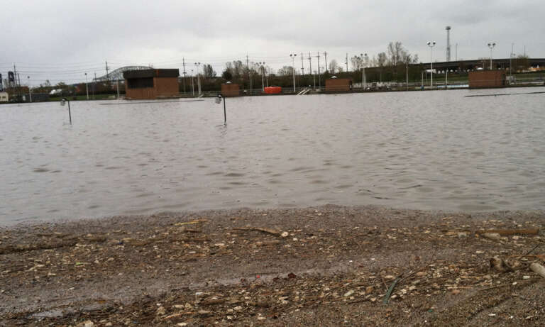 A view of the Passaic Valley Sewerage Commission plant in Newark, N.J., partially submerged by Hurricane Sandy’s storm surge, shown in October 2012. The roofs of several plant buildings are just visible above the water line, behind the mostly