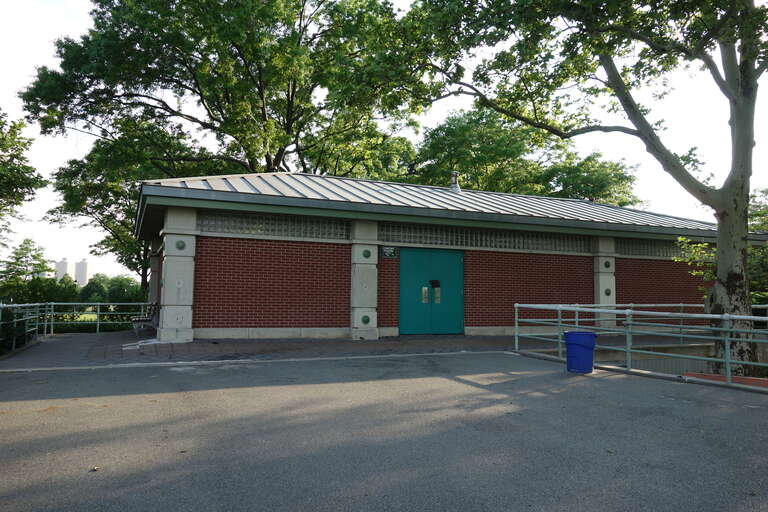 The comfort station at the north end of Meadow Lake near the former World's Fair grounds of Flushing Meadows–Corona Park, at Meadowlark Circle south of the Long Island Expressway near Corona, Queens.