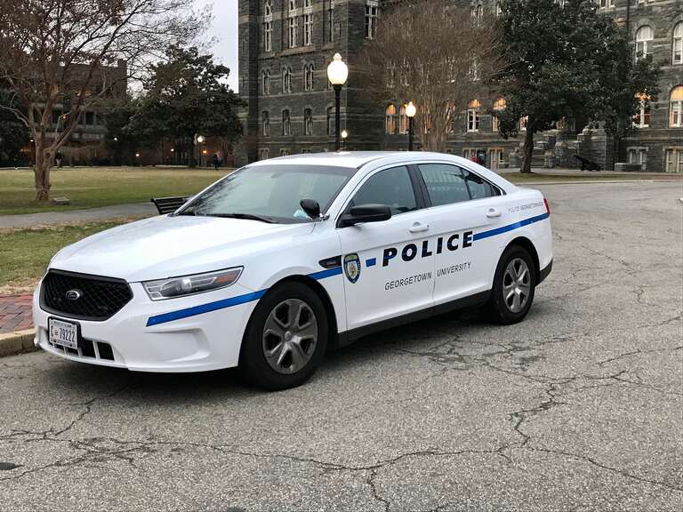 A Georgetown University Police Department (GUPD) cruiser on February 6, 2018 outside of Healy Hall on the main campus of Georgetown University in Washington, D.C. The automobile is a sixth generation Ford Taurus.