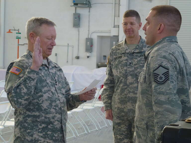 CLAY NATIONAL GUARD CENTER, Marietta, Ga. Jan 8, 2015 - General Frank J. Grass, Chief of the National Guard Bureau, administers the oath of reenlistment to Master Sgt. Brian Janssen, an Air Guardsmen with Georgia's 283rd Combat Communication