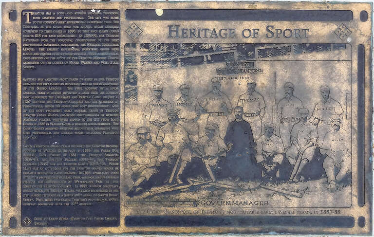 One of a series of historical bronze plaques located in the South River Walk Park on top of the Route 29 tunnel in Trenton, New Jersey.  This one commemorates baseball, basketball and hockey in Trenton.  The plaque reads as follows:
&quot;Trenton has a