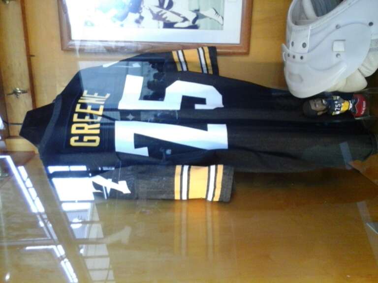 Closeup of Joe Greene's Jersey and bobble head in the Heinz Field Walk of Fame.