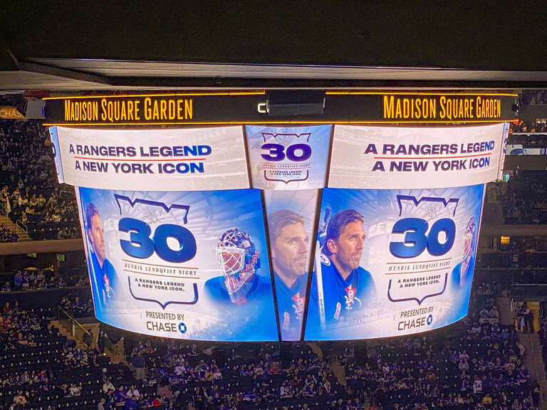 A picture of the scoreboard at Madison Square Garden
