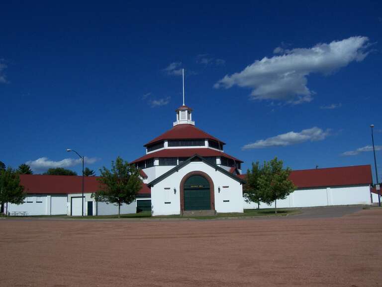 The barn w:Marathon County, Wisconsin fairgrounds in w:Wausau, Wisconsin, United States. The building is used for exhibitions. It is listed on the National Register of Historic Places.