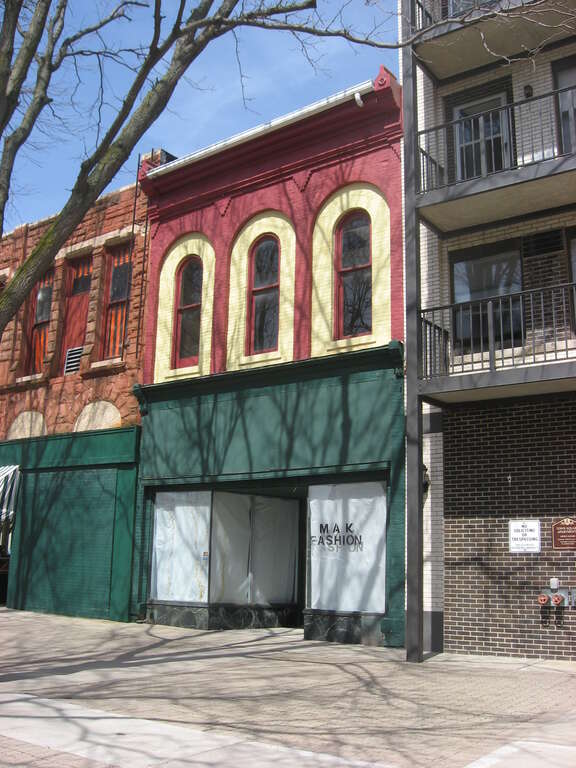 Front and side of the Neal Clothing Building, located at 74 Public Square in downtown Lima, Ohio, United States.  Built in 1865, it is listed on the National Register of Historic Places.