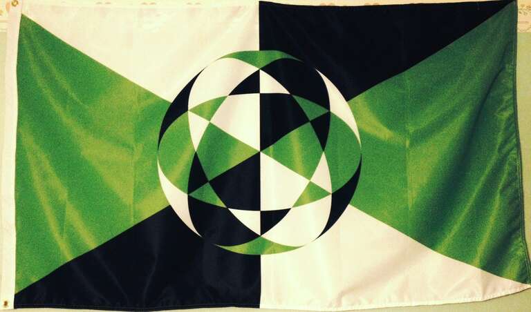 A photograph of the flag of the Modern Pagan religion of Perístanom adorning a wall.