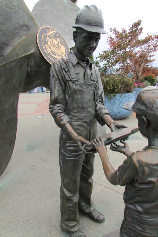 Proud Tradition memorial to the shipyard workers, on the Bremerton Boardwalk in Bremerton, Washington