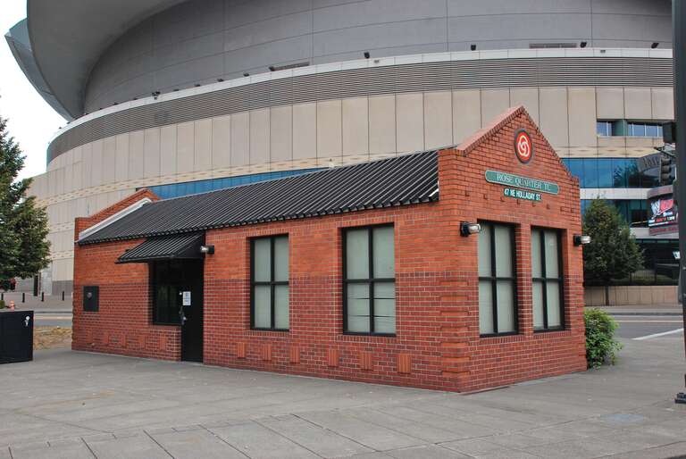 Brick building at TriMet's Rose Quarter Transit Center, for use by fare inspectors and bus/MAX operators.  The building was completed in 1990 as part of the construction of a new off-street section of the transit center, which first opened in 1986