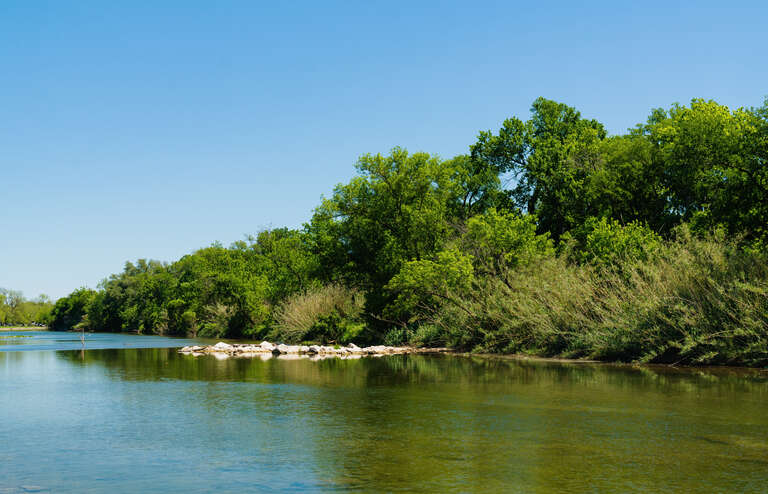 The San Gabriel River winds through Georgetown, Texas, as seen from San Gabriel Park on a spring afternoon.