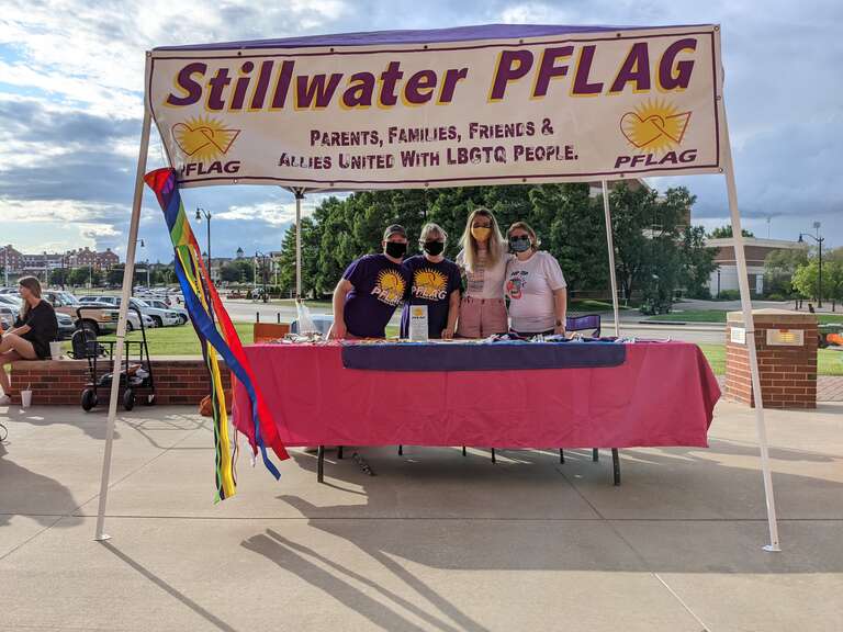 A booth setup for Stillwater PFLAG, Parents, Families, Friends &amp;amp; Allies United with LBGTQ People.