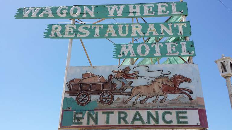 Sign for the Wagon Wheel Motel in Oxnard, California, in 2015, still standing after the motel itself was demolished.