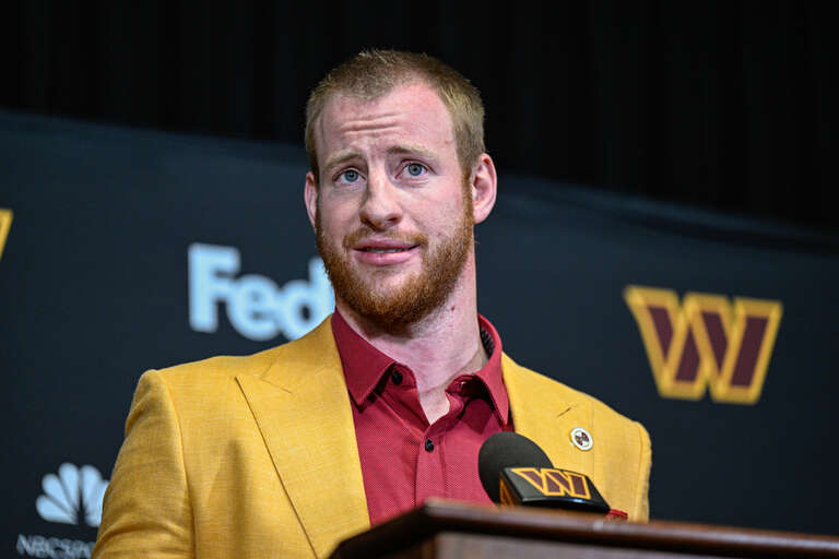Washington Commanders quarterback Carson Wentz speaks with reporters during his introductory press conference at Inova Sports Performance Center in Ashburn, Va., March 17, 2022. (Photo by Brian Murphy, All-Pro Reels)