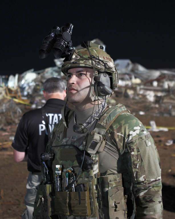 A U.S. Soldier with the Oklahoma Army National Guard participates in recovery efforts after a tornado moved through Moore, Okla., May 21, 2013.