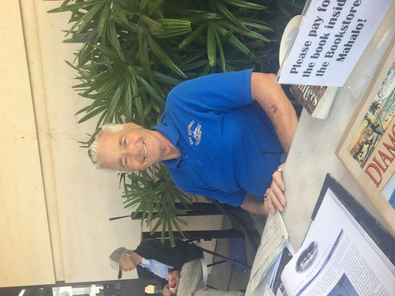 Author Allen Seiden signing books at Pearl Harbor on December 26, 2019