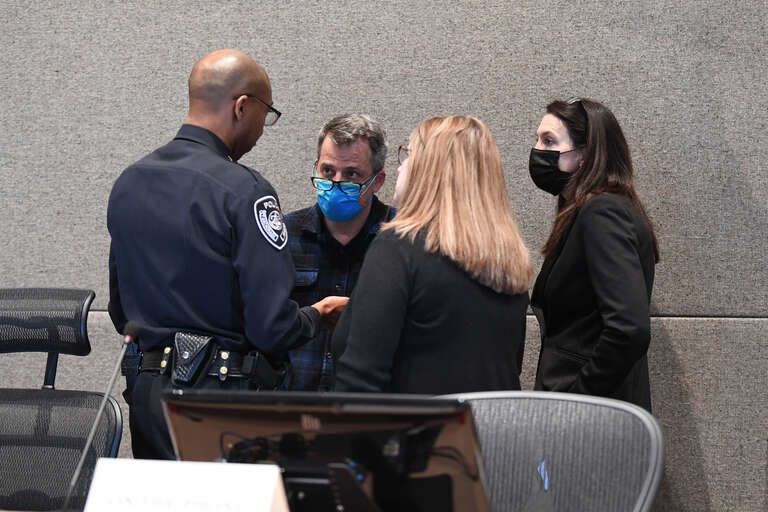 APD Chief of Police Kenneth McCoy, Assembly Co-Chair Christopher Constant, Municipal Manager Amy Demboski, and Assembly Chair Suzanne LaFrance discuss the handling of disruptions at the meeting
This photo is available for free public use. Please