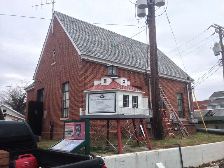 A building and a model of the Thomas Point Shoal Lighthouse on the grounds of the Annapolis Maritime Museum. The museum was origianlly founded in 1986 as the Eastport Historical Society. It was renamed the Annapolis Maritime Museum in 2000. It is