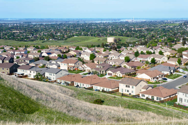 View of Antioch, California from Black Diamond Mines Regional Preserve. The Antioch Bridge on the San Joaquin River is visible in the background.