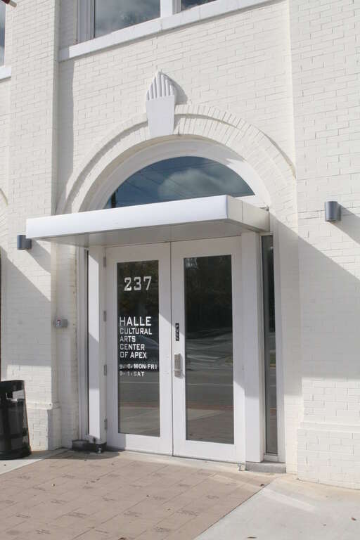 The entrance to the historic Apex Town Hall features an ornate keystone above the arch.