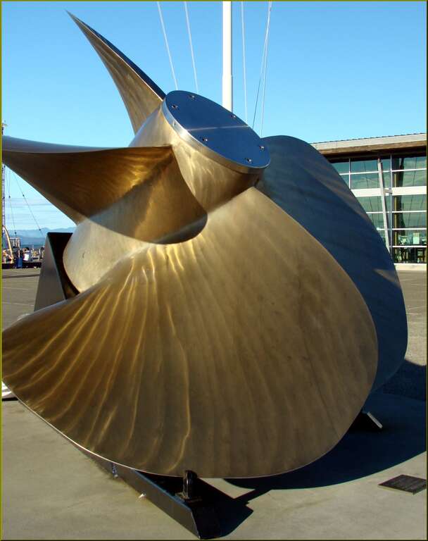 (1 in a multiple picture set)
Outside the museum was a display of maritime items such as this huge, brass propeller.  I liked the way it glinted in the lowering sun.