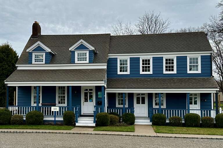 The Visitor Center, the &quot;Blue&quot; House, at the Liberty Hall in Union Township, Union County, New Jersey. Home of Mildred Barry Hughes, first woman elected to serve in the New Jersey Senate, 1966–1968.



This is an image of a place or building that is