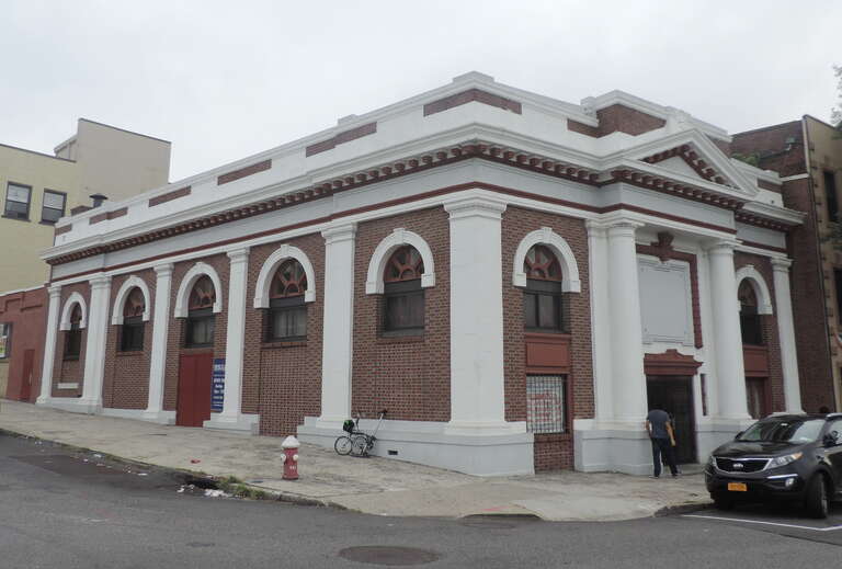 Looking southwest at church on a cloudy midday.