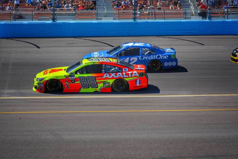 Dale Earnhardt Jr. side by side with Kyle Larson
