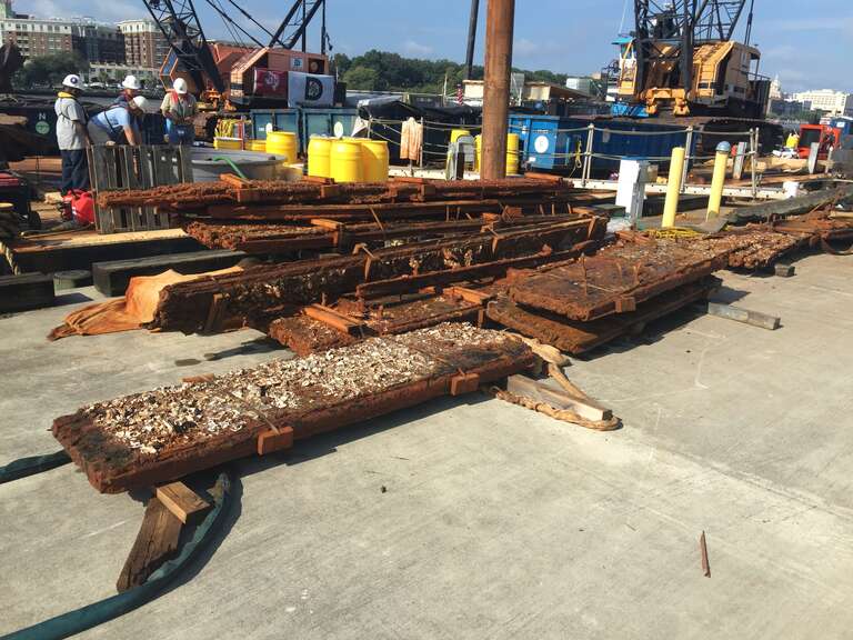 A section of the casemate, which protected the ironclad from enemy cannonballs and shells. As part of the mechanized phase of the CSS Georgia’s recovery, archaeologists are using a five-finger style grapple to raise large clumps of the remaining