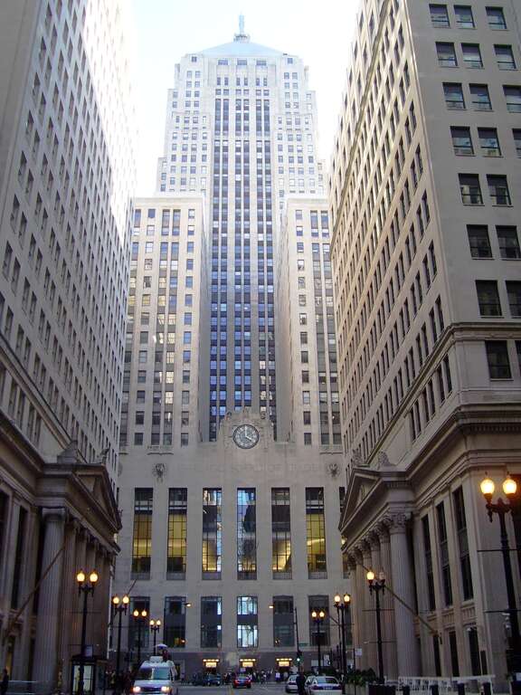 Looking south down South Lasalle Street in the Financial District of Chicago, Illinois at the Chicago Board of Trade Building, in the center, the Continental Illinois Bank Building on the left, and the Federal Reserve Bank Bulding on the right.