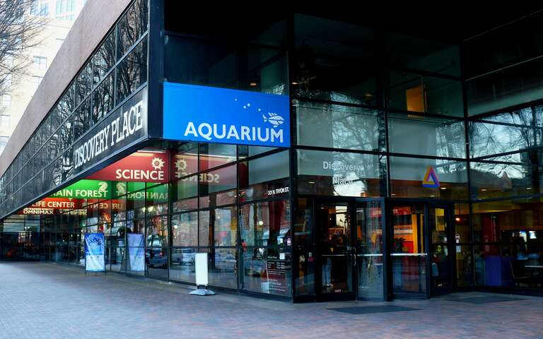 The main entrance to the Discovery Place science museum on Tryon Street in uptown Charlotte.Photo taken with a Panasonic Lumix DMC-FZ50 in Mecklenburg County, NC, USA.Cropping and post-processing performed with The GIMP.