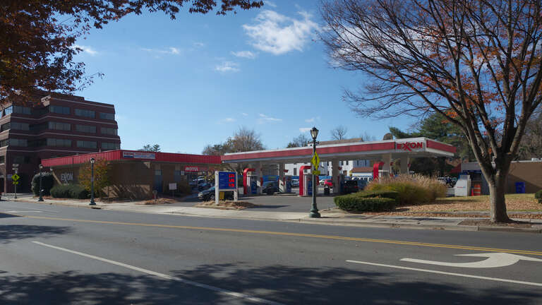 An Exxon gas station. Regular gas at $3.37 9/10 for cash or $3.39 9/10 for credit. 200 North Washington Street, Rockville, Maryland 20850.