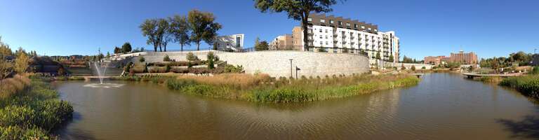 Historic Fourth Ward Park retention pond, Atlanta, Georgia, USA. Left side, facing south. Right side, facing north with view of Ponce City Market.